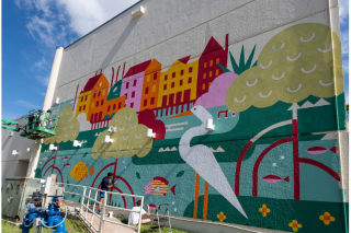 Brightly colored mural painted on side of building