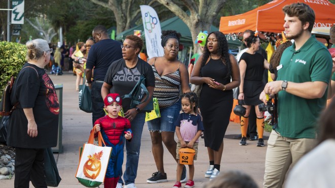 Families trick-or-treating at Halloween Fest