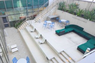 Overhead shot of indoor lounge space with green couch