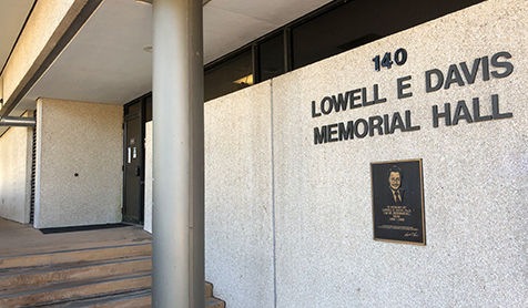 Plaque honoring former Dean Lowell E. Davis on the outside wall of Lowell E. Davis Memorial Hall
