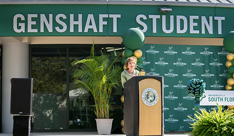 Judy Genshaft at a podium at the renaming of the Student Life Center