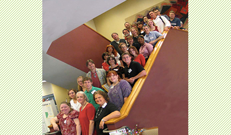 Students posing on a staircase