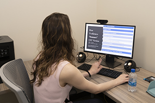 Woman sitting at computer