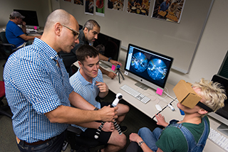 students experimenting with virtual reality goggles