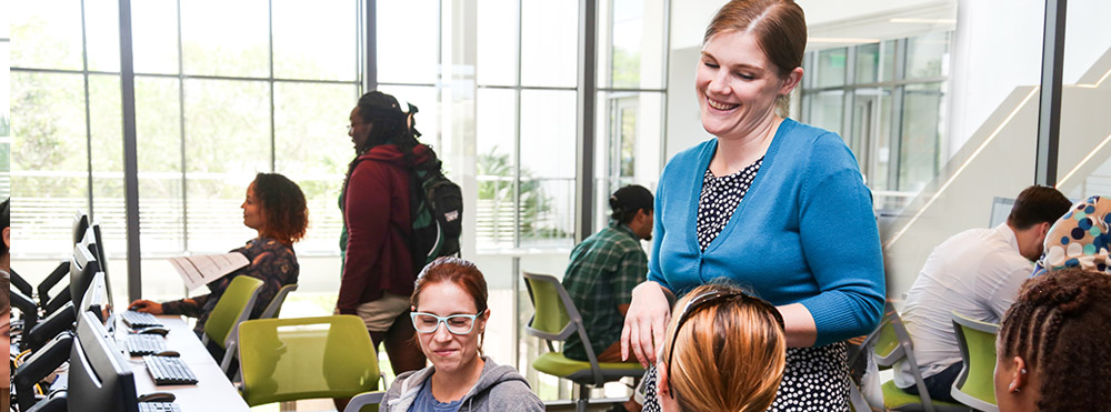 instructor smiling with students in class