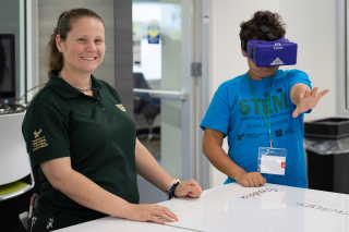 Instructor and a young student wearing a VR headset