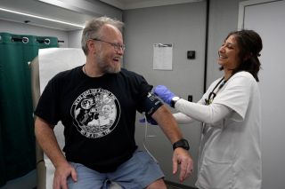 Student lauging with patient