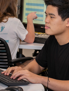 young man concentrating at computer