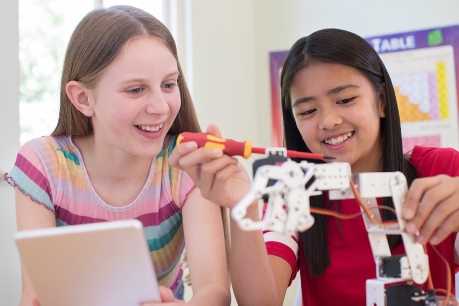 Two girls working on robotics