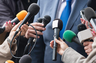 Microphones at press conference.