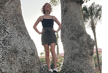 Kylie standing in a tree in Portugal