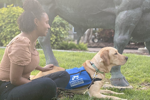 Puppy raiser with her guide dog 