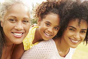 Three people smiling