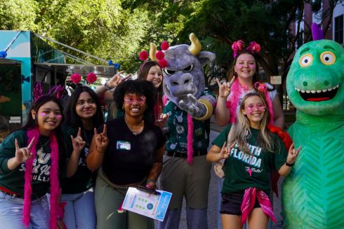 Group of young people next to Rocky the Bull