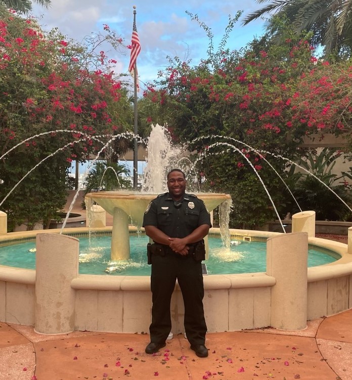 officer in front of fountain
