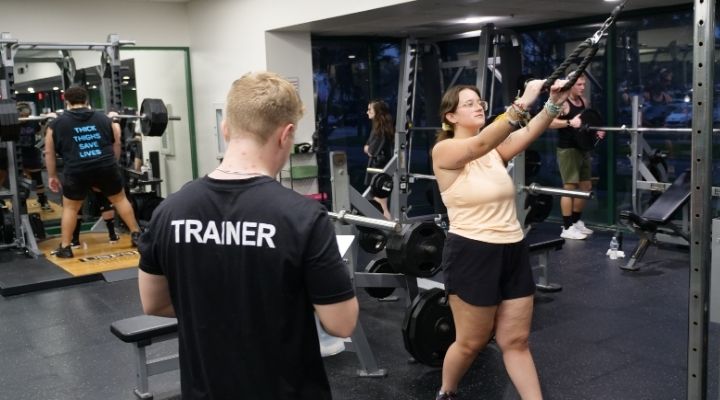 Students lifting weights