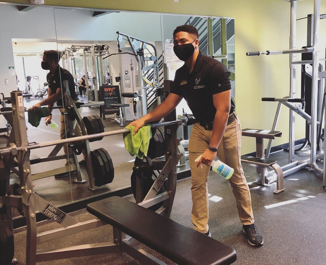 student works in fitness center