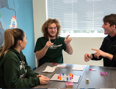 students playing game in common area