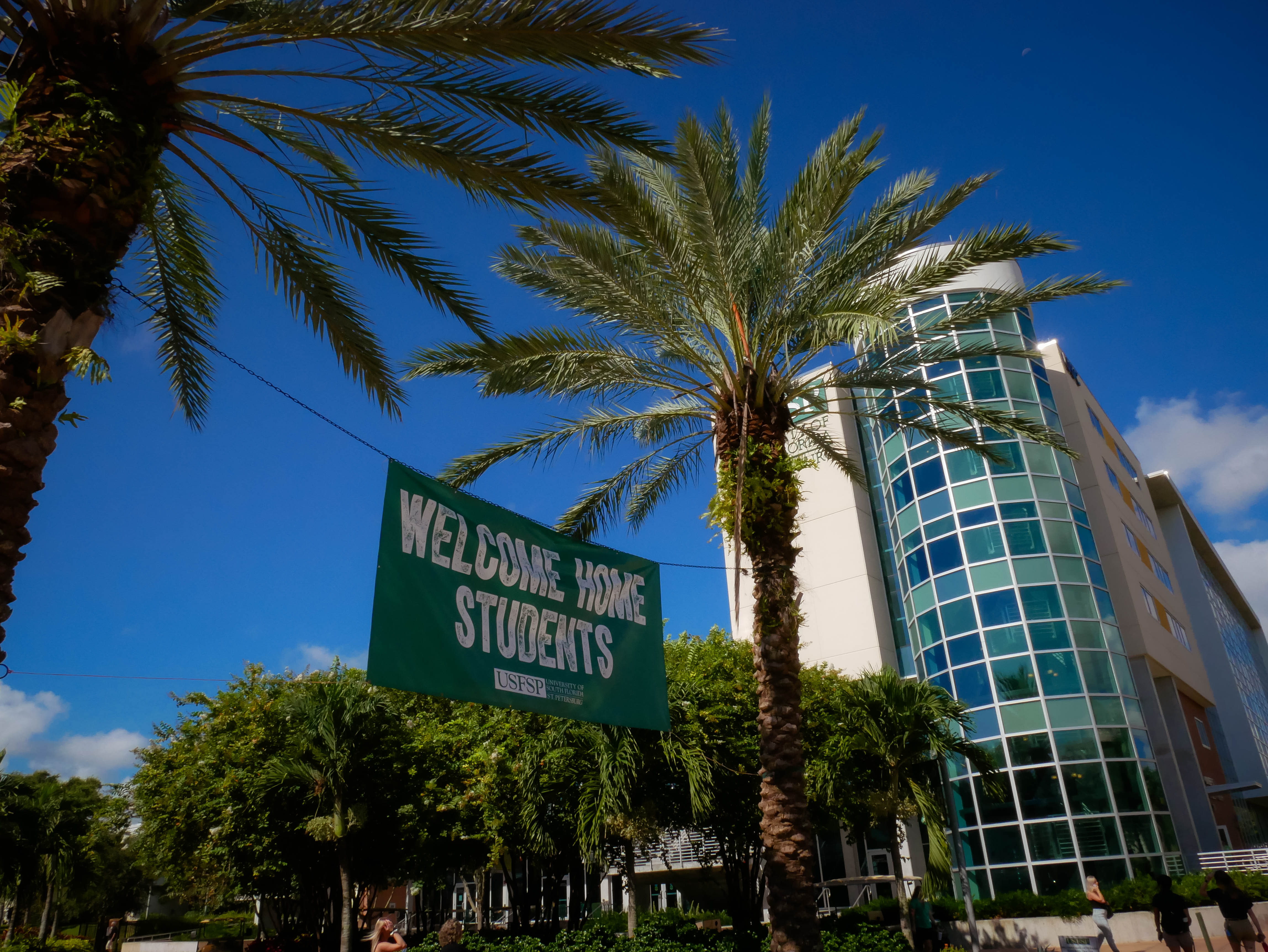 Picture of campus with banner that says Welcome Back Students