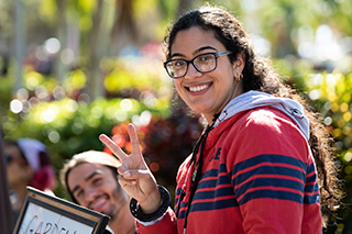 woman student smiling at event