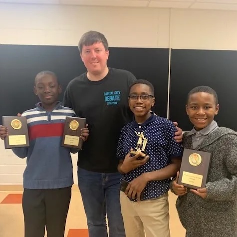 David Trigaux with students from Washington Urban Debate League.