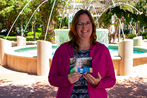 Camielle Crampsie in front of campus fountains.