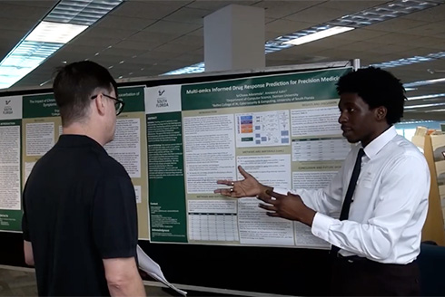Students present at research symposium.