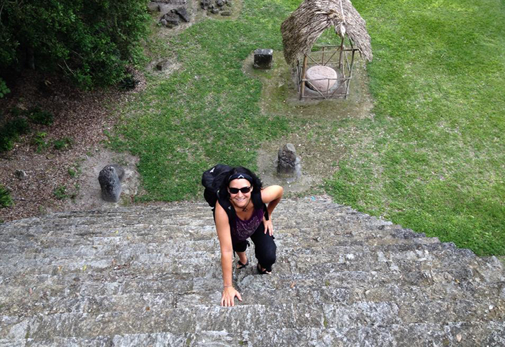 Singleton climbing a Mesoamerican pyramids during an archeological dig.