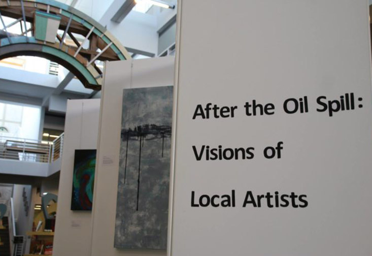 Sign reading "After the Oil Spill: Visions of Local artists."