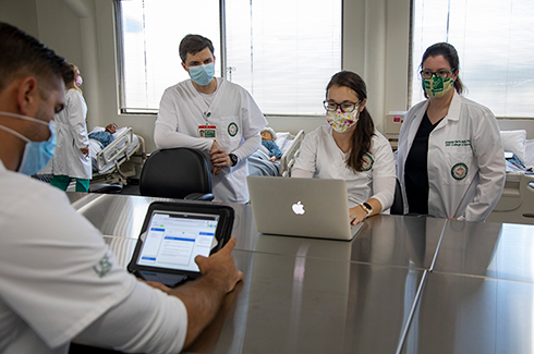 students in the nursing program working on laptops