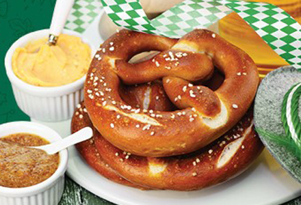 large pretzel with dipping sauces