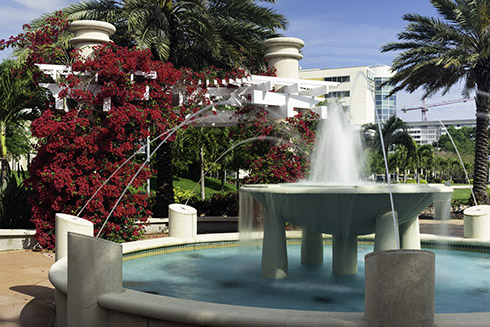 Fountain on campus with the city of St. Petersburg in the background