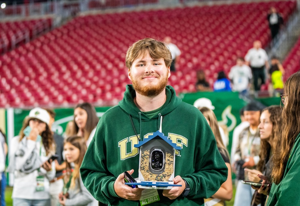 Clark Stanton using a bird feeder camera.