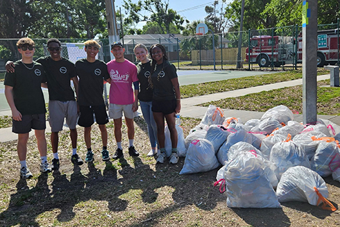 students from the USF St. Pete Bulls Business Community (BBC), part of the Muma College of Business, participated in a neighborhood clean-up to support the Thirteenth Street Heights community.