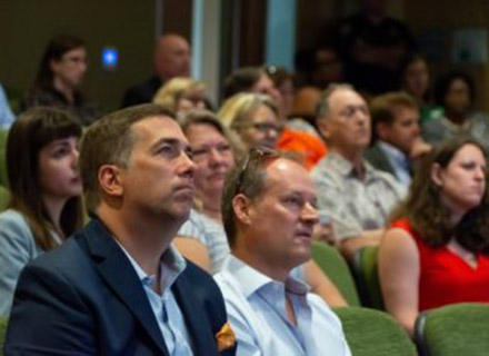 People in the audience watching the event.