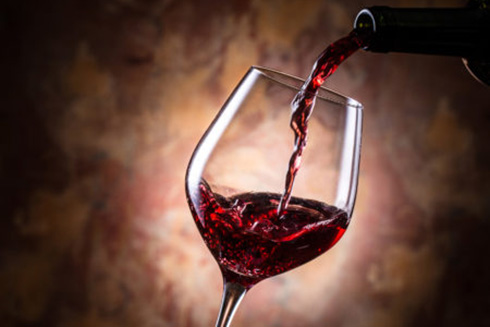 wine being poured into a glass
