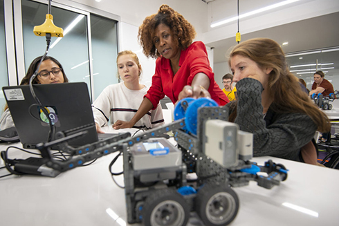 Sandra Vernon-Jackson engaging with students during the STEM robotics summer camp.