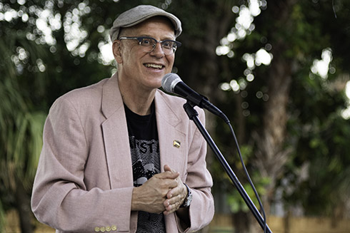 Thomas Hallock speaking into a microphone