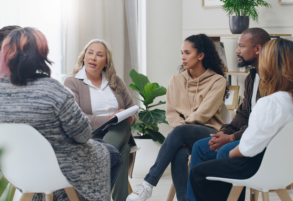 Group of diverse people receiving therapy