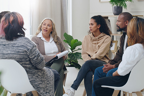 Group of diverse people receiving therapy