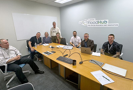 group of flood hub members sitting around a table