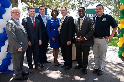 Dr. Tadlock standing with legislatures