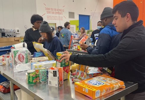 Students working at food pantry during last year's spring break volunteer trip.