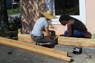 Malory Foster, IFAS staff member, and Cortney Roquemore, USFSP student, work on a Garden Build Project at the Lealman Asian Neighborhood Family Center.