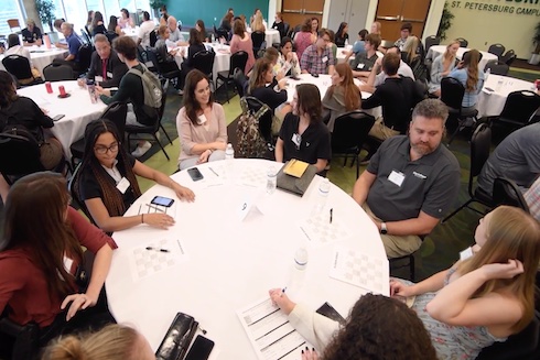 Students meet with their Innovation Scholar mentors at last year's kickoff event.