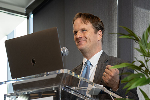 J. Michael Francis standing at a podium