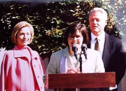 Professor Judithanne Scourfield McLauchlan with President Bill Clinton and Hillary Clinton in the rose garden.