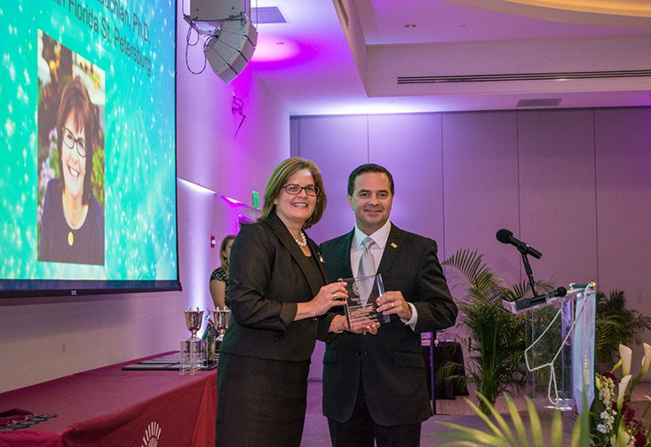 USFSP Associate Professor of Political Science Judithanne Scourfield McLauchlan receiving the 2018 Graham-Frey Civic Educator Award.