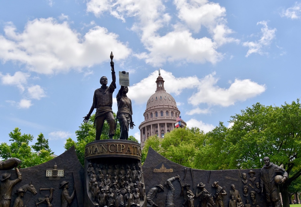 The Texas African American History Memorial accompanied by the words USF celebrates Juneteenth with our community.