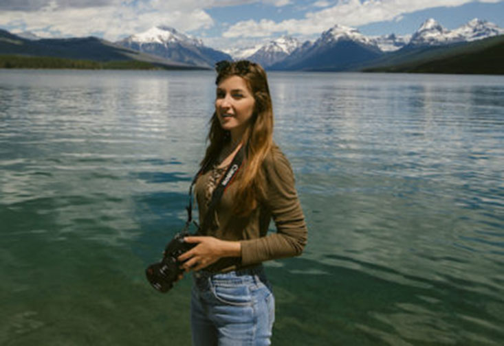 Kelly Stefanski at Glacier National Park capturing stunning landscape and wildlife imagery.